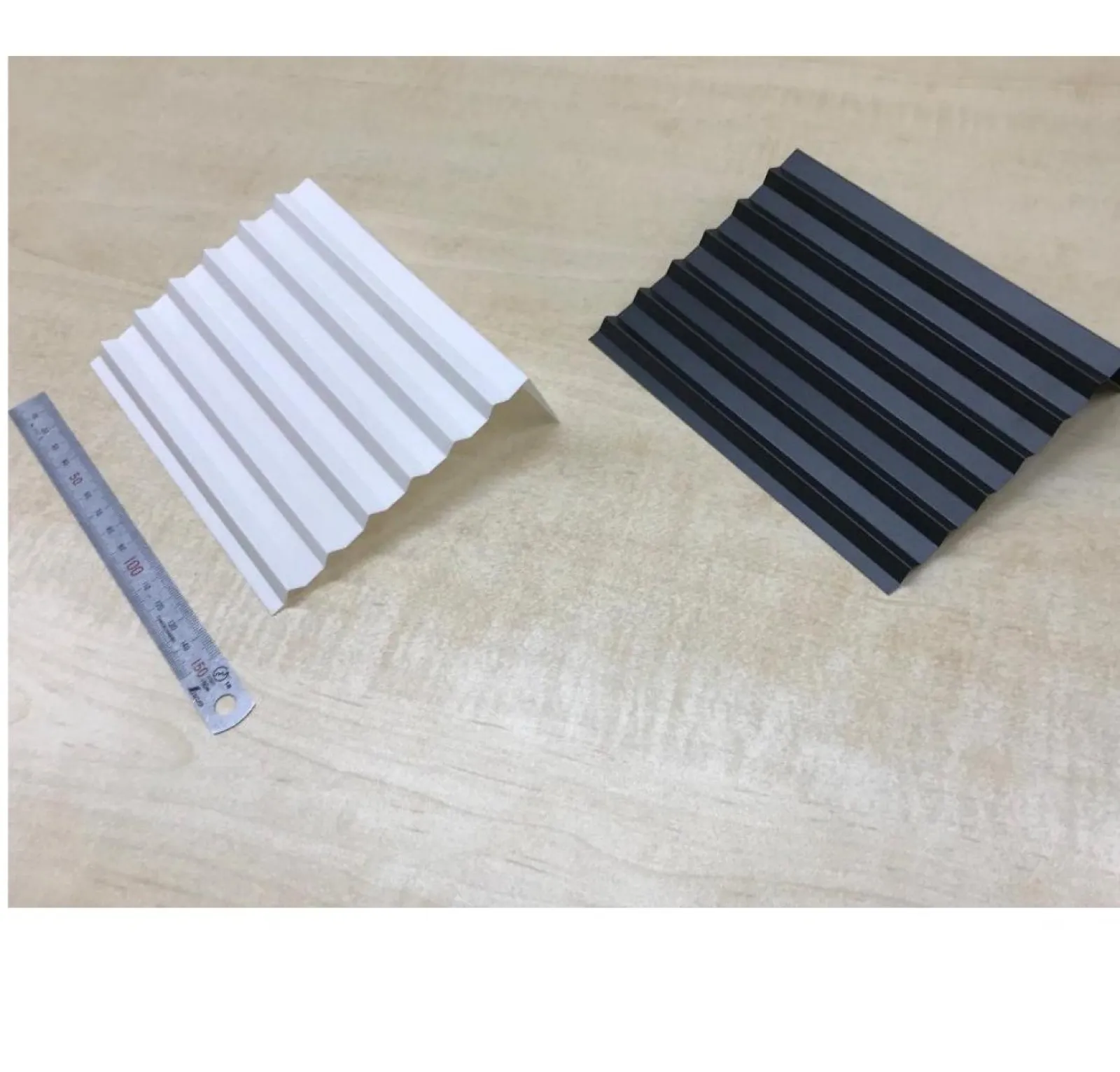 V-block bent corrugated PC-FR V0 profiles in natural and black — accordion insulation barriers